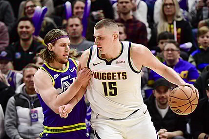 Jan 10, 2024; Salt Lake City, Utah, USA; Utah Jazz forward/center Kelly Olynyk (41) defends Denver Nuggets center Nikola Jokic (15) during the second half at the Delta Center. Mandatory Credit: Christopher Creveling-USA TODAY Sports
