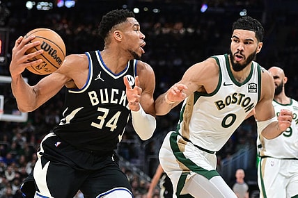 Jan 11, 2024; Milwaukee, Wisconsin, USA; Milwaukee Bucks forward Giannis Antetokounmpo (34) drives for the basket against Boston Celtics forward Jayson Tatum (0) in the second quarter at Fiserv Forum. Mandatory Credit: Benny Sieu-USA TODAY Sports