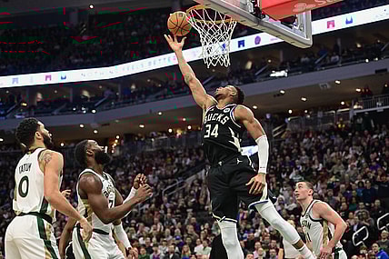 Jan 11, 2024; Milwaukee, Wisconsin, USA; Milwaukee Bucks forward Giannis Antetokounmpo (34) takes a shot in the second quarter against the Boston Celtics at Fiserv Forum. Mandatory Credit: Benny Sieu-USA TODAY Sports