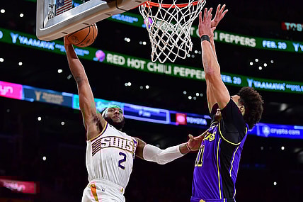 Jan 11, 2024; Los Angeles, California, USA; Phoenix Suns forward Josh Okogie (2) dunks for the basket against Los Angeles Lakers center Jaxson Hayes (11) during the first half at Crypto.com Arena. Mandatory Credit: Gary A. Vasquez-USA TODAY Sports