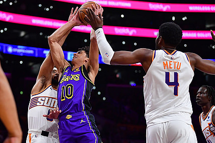 Jan 11, 2024; Los Angeles, California, USA; Los Angeles Lakers guard Max Christie (10) moves to the basket against Phoenix Suns guard Jordan Goodwin (0) and forward Chimezie Metu (4) during the second half at Crypto.com Arena. Mandatory Credit: Gary A. Vasquez-USA TODAY Sports