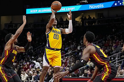 Jan 12, 2024; Atlanta, Georgia, USA; Indiana Pacers guard Bennedict Mathurin (00) shoots over Atlanta Hawks forward Onyeka Okongwu (17) during the first half at State Farm Arena. Mandatory Credit: Dale Zanine-USA TODAY Sports