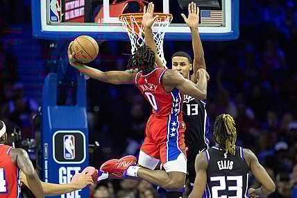 Jan 12, 2024; Philadelphia, Pennsylvania, USA; Philadelphia 76ers guard Tyrese Maxey (0) drives for a score against Sacramento Kings forward Keegan Murray (13) during the second quarter at Wells Fargo Center. Mandatory Credit: Bill Streicher-USA TODAY Sports