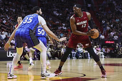Jan 12, 2024; Miami, Florida, USA; Miami Heat center Bam Adebayo (13) protects the basketball from Orlando Magic center Goga Bitadze (35) during the second quarter at Kaseya Center. Mandatory Credit: Sam Navarro-USA TODAY Sports