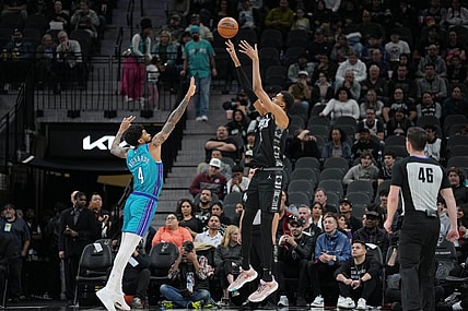 Jan 12, 2024; San Antonio, Texas, USA;  San Antonio Spurs center Victor Wembanyama (1) shoots over Charlotte Hornets center Nick Richards (4) in the first half at Frost Bank Center. Mandatory Credit: Daniel Dunn-USA TODAY Sports