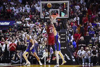 Jan 12, 2024; Miami, Florida, USA; Miami Heat center Bam Adebayo (13) scores against Orlando Magic center Moritz Wagner (21) during the fourth quarter at Kaseya Center. Mandatory Credit: Sam Navarro-USA TODAY Sports