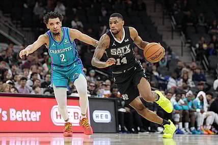 Jan 12, 2024; San Antonio, Texas, USA;  San Antonio Spurs guard Blake Wesley (14) dribbles against Charlotte Hornets guard James Bouknight (2) in the second half at Frost Bank Center. Mandatory Credit: Daniel Dunn-USA TODAY Sports