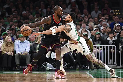 Jan 13, 2024; Boston, Massachusetts, USA;  Houston Rockets forward Jeff Green (32) controls the ball away from Boston Celtics forward Jayson Tatum (0) during the first half at TD Garden. Mandatory Credit: Bob DeChiara-USA TODAY Sports