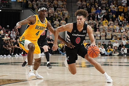 Jan 13, 2024; Waco, Texas, USA; Cincinnati Bearcats guard Dan Skillings Jr. (0) works around Baylor Bears guard Ja'Kobe Walter (4) during the first half at Paul and Alejandra Foster Pavilion. Mandatory Credit: Raymond Carlin III-USA TODAY Sports
