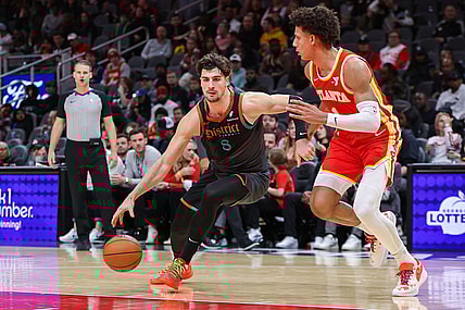 Jan 13, 2024; Atlanta, Georgia, USA; Washington Wizards forward Deni Avdija (8) drives on Atlanta Hawks forward Jalen Johnson (1) in the second half at State Farm Arena. Mandatory Credit: Brett Davis-USA TODAY Sports