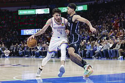 Jan 13, 2024; Oklahoma City, Oklahoma, USA; Oklahoma City Thunder forward Chet Holmgren (7) drives to the basket against Orlando Magic guard Cole Anthony (50) during the second half at Paycom Center. Mandatory Credit: Alonzo Adams-USA TODAY Sports