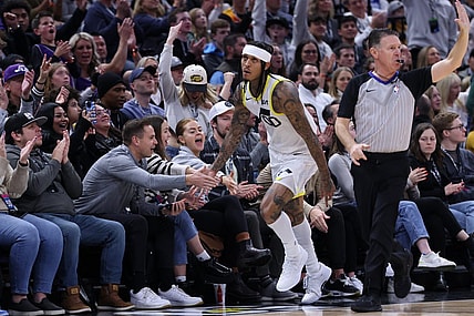 Jan 13, 2024; Salt Lake City, Utah, USA; Utah Jazz guard Jordan Clarkson (00) slaps hands with fans after making a three point basket against the Los Angeles Lakers during the second quarter at Delta Center. Mandatory Credit: Rob Gray-USA TODAY Sports