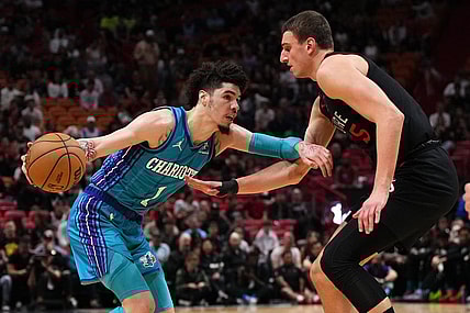 Jan 14, 2024; Miami, Florida, USA; Charlotte Hornets guard LaMelo Ball (1) drives the ball around Miami Heat forward Nikola Jovic (5) during the first half at Kaseya Center. Mandatory Credit: Jasen Vinlove-USA TODAY Sports