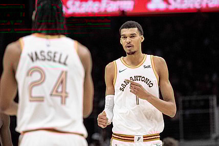 Jan 15, 2024; Atlanta, Georgia, USA; San Antonio Spurs center Victor Wembanyama (1) talks to teammate guard Devin Vassell (24) in the game against Atlanta Hawks during the first quarter at State Farm Arena. Mandatory Credit: Jordan Godfree-USA TODAY Sports