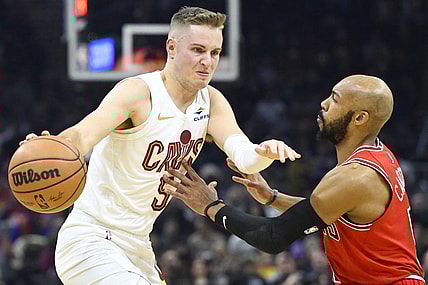 Jan 15, 2024; Cleveland, Ohio, USA; Cleveland Cavaliers guard Sam Merrill (5) dribbles beside Chicago Bulls guard Jevon Carter (5) in the second quarter at Rocket Mortgage FieldHouse. Mandatory Credit: David Richard-USA TODAY Sports