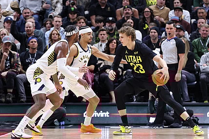 Jan 15, 2024; Salt Lake City, Utah, USA; Utah Jazz forward Lauri Markkanen (23) looks to drive against Indiana Pacers guard Buddy Hield (7) and guard Andrew Nembhard (2) during the second quarter at Delta Center. Mandatory Credit: Rob Gray-USA TODAY Sports