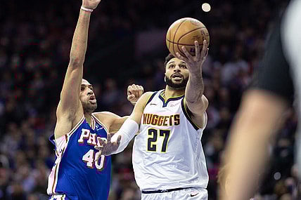 Jan 16, 2024; Philadelphia, Pennsylvania, USA; Denver Nuggets guard Jamal Murray (27) drives for a score past Philadelphia 76ers forward Nicolas Batum (40) during the second quarter at Wells Fargo Center. Mandatory Credit: Bill Streicher-USA TODAY Sports
