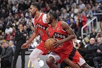 Jan 17, 2024; Toronto, Ontario, CAN; Toronto Raptors RJ Barrett (9)and  Toronto Raptors forward Jontay Porter (11) head up court against Miami Heat during the first half at Scotiabank Arena. Mandatory Credit: John E. Sokolowski-USA TODAY Sports