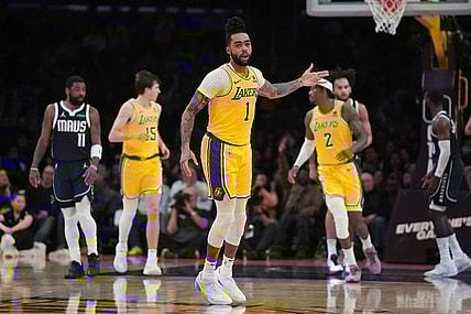 Jan 17, 2024; Los Angeles, California, USA; Los Angeles Lakers guard D'Angelo Russell (1) gestures after a three-point basket against the Dallas Mavericks in the first half at Crypto.com Arena. Mandatory Credit: Kirby Lee-USA TODAY Sports