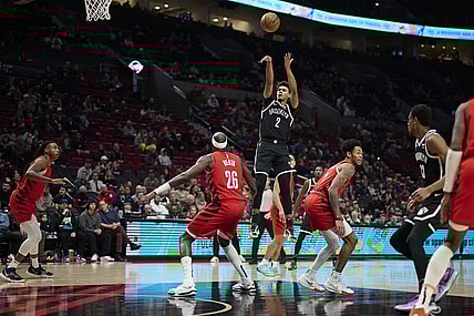 Jan 17, 2024; Portland, Oregon, USA; Brooklyn Nets forward Cameron Johnson (2) shoots a basket during the first half against Portland Trail Blazers center Duop Reath (26) at Moda Center. Mandatory Credit: Troy Wayrynen-USA TODAY Sports