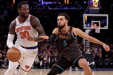 Jan 18, 2024; New York, New York, USA; New York Knicks forward Julius Randle (30) drives to the basket against Washington Wizards guard Tyus Jones (5) during the second quarter at Madison Square Garden. Mandatory Credit: Brad Penner-USA TODAY Sports