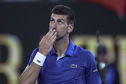 Jan 19, 2024; Melbourne, Victoria, Australia; Novak Djokovic of Serbia celebrates his win against Tomas Martin Etcheverry (not pictured) of Argentina in Round 3 of the Men's Singles on Day 6 of the Australian Open tennis at Rod Laver Arena. Mandatory Credit: Mike Frey-USA TODAY Sports