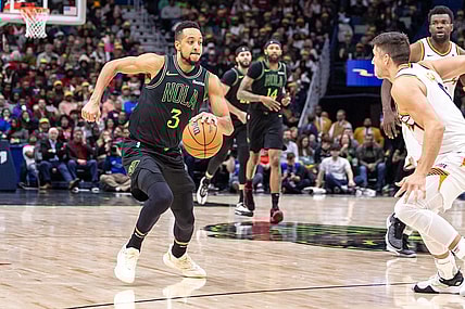 Jan 19, 2024; New Orleans, Louisiana, USA;  New Orleans Pelicans guard CJ McCollum (3) dribbles against Phoenix Suns guard Grayson Allen (8) during the second half at Smoothie King Center. Mandatory Credit: Stephen Lew-USA TODAY Sports