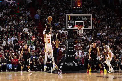 Jan 19, 2024; Miami, Florida, USA; Atlanta Hawks guard Dejounte Murray (5) attempts a three point shot against the Miami Heat during the first half at Kaseya Center. Mandatory Credit: Jasen Vinlove-USA TODAY Sports
