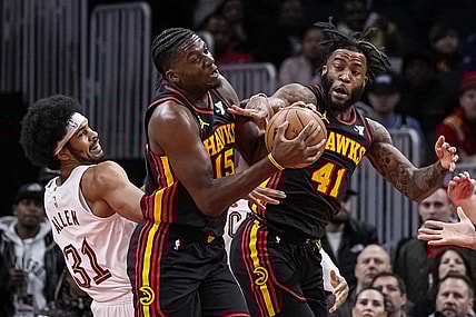 Jan 20, 2024; Atlanta, Georgia, USA; Atlanta Hawks center Clint Capela (15) and forward Saddiq Bey (41) fight for a rebound with Cleveland Cavaliers center Jarrett Allen (31) during the first half at State Farm Arena. Mandatory Credit: Dale Zanine-USA TODAY Sports