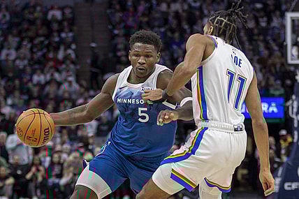 Jan 20, 2024; Minneapolis, Minnesota, USA; Minnesota Timberwolves guard Anthony Edwards (5) dribbles the ball as Oklahoma City Thunder guard Isaiah Joe (11) plays defense in the second half at Target Center. Mandatory Credit: Jesse Johnson-USA TODAY Sports