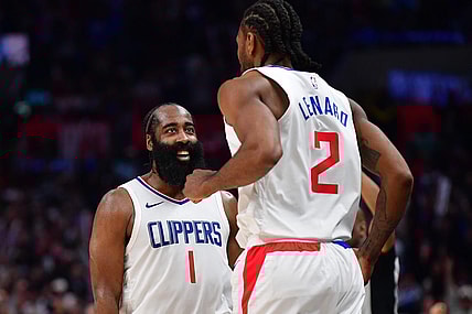 Jan 21, 2024; Los Angeles, California, USA; Los Angeles Clippers guard James Harden (1) reacts after forward Kawhi Leonard (2) scores three point basket against the Brooklyn Nets during the second half at Crypto.com Arena. Mandatory Credit: Gary A. Vasquez-USA TODAY Sports