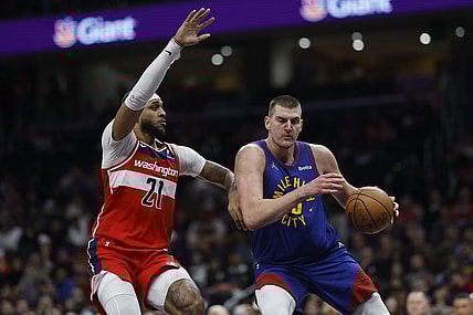 Jan 21, 2024; Washington, District of Columbia, USA; Denver Nuggets center Nikola Jokic (15) drives to the basket as Washington Wizards center Daniel Gafford (21) defends in the first half at Capital One Arena. Mandatory Credit: Geoff Burke-USA TODAY Sports