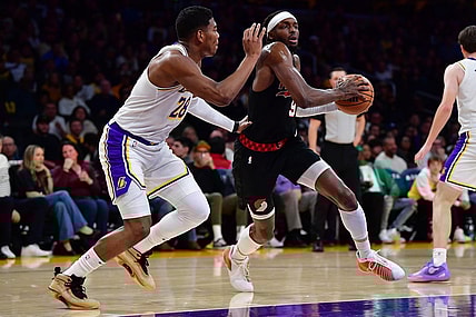 Jan 21, 2024; Los Angeles, California, USA; Portland Trail Blazers forward Jerami Grant (9) moves the ball against Los Angeles Lakers forward Rui Hachimura (28) during the first half at Crypto.com Arena. Mandatory Credit: Gary A. Vasquez-USA TODAY Sports