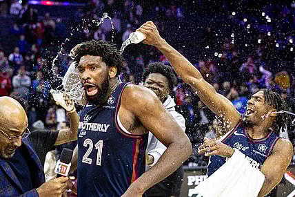 Jan 22, 2024; Philadelphia, Pennsylvania, USA; Philadelphia 76ers center Joel Embiid (21) is doused with water by teammates after scoring 70 points in a victory against the San Antonio Spurs at Wells Fargo Center. Mandatory Credit: Bill Streicher-USA TODAY Sports