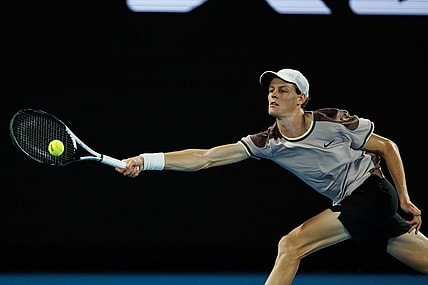 Jan 23, 2024; Melbourne, Victoria, Australia;  Jannik Sinner of Italy in action against Andrey Rublev of Russia in the quarter final of the men s singles. Mandatory Credit: Mike Frey-USA TODAY Sports