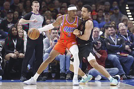 Jan 23, 2024; Oklahoma City, Oklahoma, USA; Oklahoma City Thunder guard Shai Gilgeous-Alexander (2) drives against Portland Trail Blazers guard Malcolm Brogdon (11) during the first quarter at Paycom Center. Mandatory Credit: Alonzo Adams-USA TODAY Sports