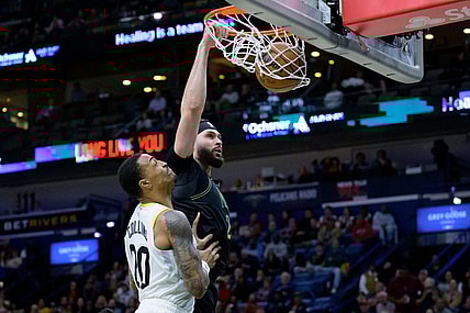 Jan 23, 2024; New Orleans, Louisiana, USA;  New Orleans Pelicans forward Larry Nance Jr. (22) dunks against Utah Jazz forward John Collins (20) during the first half at Smoothie King Center. Mandatory Credit: Matthew Hinton-USA TODAY Sports