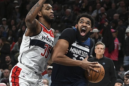 Jan 24, 2024; Washington, District of Columbia, USA; Minnesota Timberwolves center Karl-Anthony Towns (32) move to the the basket on Washington Wizards forward Marvin Bagley III (35) during the first half  at Capital One Arena. Mandatory Credit: Tommy Gilligan-USA TODAY Sports