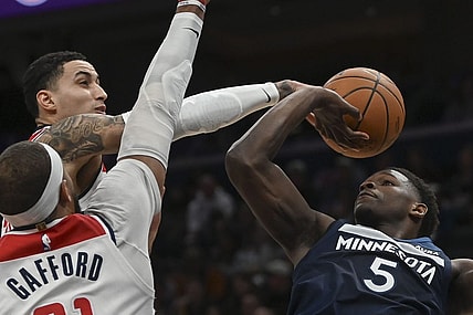 Jan 24, 2024; Washington, District of Columbia, USA;  Washington Wizards forward Kyle Kuzma (33) blocks Minnesota Timberwolves guard Anthony Edwards (5) first half shot at Capital One Arena. Mandatory Credit: Tommy Gilligan-USA TODAY Sports