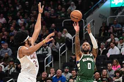 Jan 24, 2024; Milwaukee, Wisconsin, USA;  Milwaukee Bucks guard Damian Lillard (0) takes a shot against Cleveland Cavaliers center Jarrett Allen (31) in the first quarter at Fiserv Forum. Mandatory Credit: Benny Sieu-USA TODAY Sports