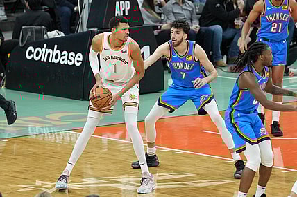 Jan 24, 2024; San Antonio, Texas, USA;  San Antonio Spurs center Victor Wembanyama (1) looks to pass in front of Oklahoma City Thunder forward Chet Holmgren (7) in the first half at Frost Bank Center. Mandatory Credit: Daniel Dunn-USA TODAY Sports