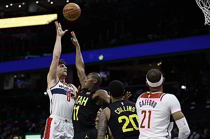 Jan 25, 2024; Washington, District of Columbia, USA; Washington Wizards forward Deni Avdija (8) shoots the ball over Utah Jazz guard Kris Dunn (11) in the first half at Capital One Arena. Mandatory Credit: Geoff Burke-USA TODAY Sports