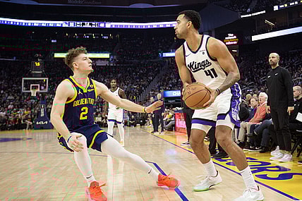 Jan 25, 2024; San Francisco, California, USA; Sacramento Kings forward Trey Lyles (41) looks to pass over Golden State Warriors guard Brandin Podziemski (2) during the first quarter at Chase Center. Mandatory Credit: D. Ross Cameron-USA TODAY Sports