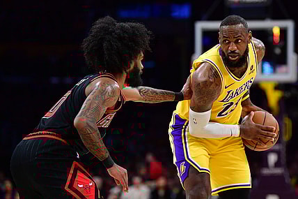 Jan 25, 2024; Los Angeles, California, USA; Los Angeles Lakers forward LeBron James (23) controls the ball against Chicago Bulls guard Coby White (0) during the first half at Crypto.com Arena. Mandatory Credit: Gary A. Vasquez-USA TODAY Sports
