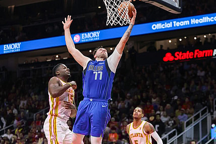 Jan 26, 2024; Atlanta, Georgia, USA; Dallas Mavericks guard Luka Doncic (77) shoots against the Atlanta Hawks in the second quarter at State Farm Arena. Mandatory Credit: Brett Davis-USA TODAY Sports