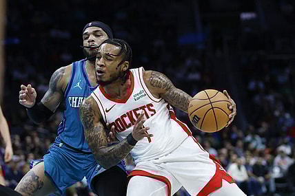 Jan 26, 2024; Charlotte, North Carolina, USA; Houston Rockets forward Cam Whitmore (7) moves against Charlotte Hornets forward Miles Bridges (0) during the second half at Spectrum Center. Mandatory Credit: Nell Redmond-USA TODAY Sports