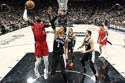 Jan 26, 2024; San Antonio, Texas, USA; Portland Trail Blazers center Deandre Ayton (2) shoots over San Antonio Spurs forward Victor Wembanyama (1) during the first half at Frost Bank Center. Mandatory Credit: Scott Wachter-USA TODAY Sports
