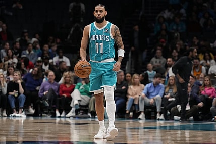 Jan 27, 2024; Charlotte, North Carolina, USA;  Charlotte Hornets forward Cody Martin (11) handles the ball against the Utah Jazz during the second quarter at Spectrum Center. Mandatory Credit: Jim Dedmon-USA TODAY Sports