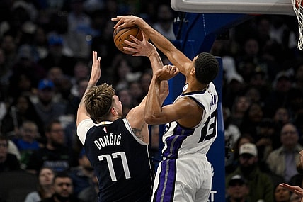 Jan 27, 2024; Dallas, Texas, USA; Sacramento Kings forward Keegan Murray (13) blocks a shot by Dallas Mavericks guard Luka Doncic (77) during the second quarter at the American Airlines Center. Mandatory Credit: Jerome Miron-USA TODAY Sports