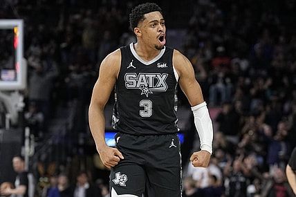 Jan 27, 2024; San Antonio, Texas, USA; San Antonio Spurs forward Keldon Johnson (3) reacts after scoring a three point basket during the second half against the Minnesota Timberwolves at Frost Bank Center. Mandatory Credit: Scott Wachter-USA TODAY Sports